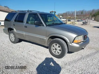 2001 GMC Jimmy SLE z VIN 1GKDT13W812117348, wystawiony jako IAAI lot #41846712 z przebiegiem 180 977 mil mil oraz . Historia ofert i sprzedaży dostępna na DreamBid. Obrazek 1.