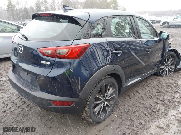 2017 Mazda CX-3 Grand Touring with VIN JM1DKFD75H0179167, listed as a IAAI auction lot 41980243 with 69,076 mi miles. Bid and sale history available at carsss.com. Image 4.