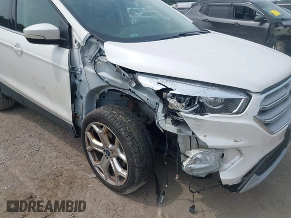 2019 Ford Escape Titanium with VIN 1FMCU9J90KUA86338, listed as a IAAI auction lot 42690159 with 115,891 mi miles and . Bid and sale history available at DreamBid. Image 6.