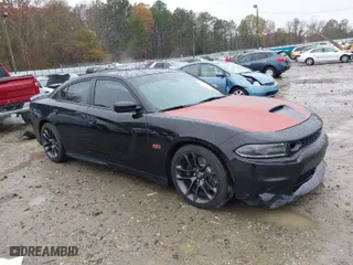 2021 Dodge Charger Scat Pack Widebody with VIN 2C3CDXGJ9MH643347, listed as a IAAI auction lot 41028032 with 76,615 mi miles. Bid and sale history available at carsss.com. Image 1.