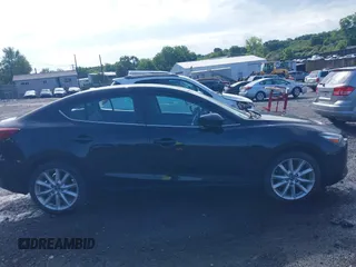 2017 Mazda 3 Touring z VIN 3MZBN1V74HM128575, wystawiony jako IAAI lot #42731487 z przebiegiem 136 553 mil mil oraz . Historia ofert i sprzedaży dostępna na DreamBid. Obrazek 13.