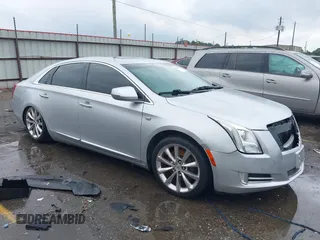 2013 Cadillac XTS Premium z VIN 2G61S5S33D9145759, wystawiony jako IAAI lot #42104810 z przebiegiem 196 049 mil mil oraz . Historia ofert i sprzedaży dostępna na DreamBid. Obrazek 1.