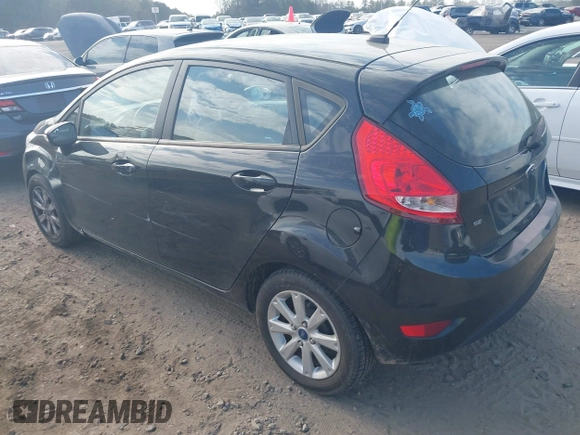 2013 Ford Fiesta SE with VIN 3FADP4EJ7DM140755, listed as a IAAI auction lot 41908366 with 68,744 mi miles. Bid and sale history available at carsss.com. Image 3.