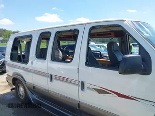 1999 Ford Econoline Cargo Recreational with VIN 1FDRE14L2XHA41059, listed as a IAAI auction lot 42067879 with 149,185 mi miles. Bid and sale history available at carsss.com. Image 17.