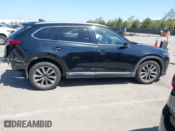 2016 Mazda CX-9 Grand Touring with VIN JM3TCBDY4G0113693, listed as a IAAI auction lot 41965857 with 152,403 mi miles and . Bid and sale history available at DreamBid. Image 14.