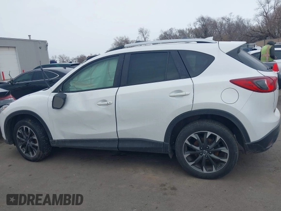 2016 Mazda CX-5 Grand Touring z VIN JM3KE2DY8G0885006, wystawiony jako IAAI lot #41615873 z przebiegiem 118 890 mil mil oraz . Historia ofert i sprzedaży dostępna na DreamBid. Obrazek 14.