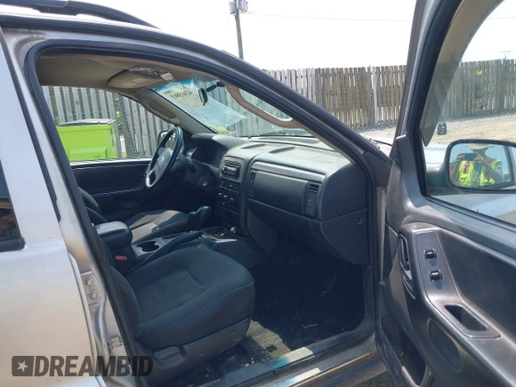 2003 Jeep Grand Cherokee Laredo with VIN 1J4GW48S83C558962, listed as a IAAI auction lot 42415803 with 312,419 mi miles and . Bid and sale history available at DreamBid. Image 5.
