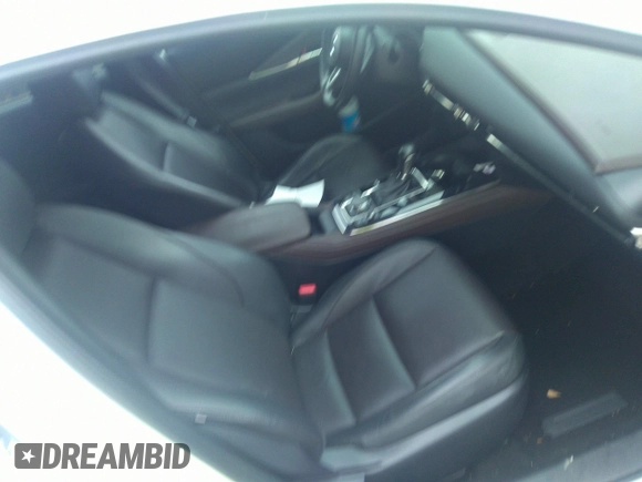 2021 Mazda CX-30 Premium with VIN 3MVDMADL5MM318729, listed as a IAAI auction lot 41645560 with 51,132 mi miles and . Bid and sale history available at DreamBid. Image 5.