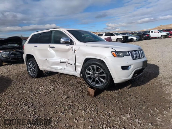 2017 Jeep Grand Cherokee Overland with VIN 1C4RJFCG7HC707767, listed as a Copart auction lot 82345154 with 96,374 mi miles and Salvage Title. Bid and sale history available at carsss.com. Image 14.