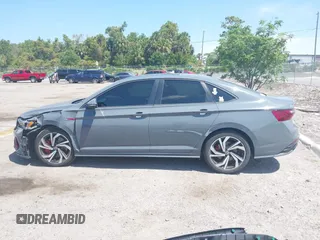 2023 Volkswagen Jetta GLI Autobahn with VIN 3VW2T7BU0PM001596, listed as a IAAI auction lot 42120162 with 72,778 mi miles and . Bid and sale history available at DreamBid. Image 14.