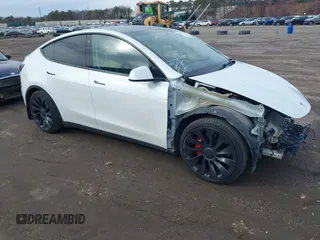 2021 Tesla Model Y Performance with VIN 5YJYGDEF1MF262930, listed as a IAAI auction lot 41606321 with 28,882 mi miles. Bid and sale history available at carsss.com. Image 1.