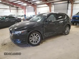 2021 Mazda CX-5 Grand Touring Reserve with VIN JM3KFBAY7M0308125, listed as a Copart auction lot 49658085 with 76,470 mi miles and Clean Title. Bid and sale history available at carsss.com. Image 1.
