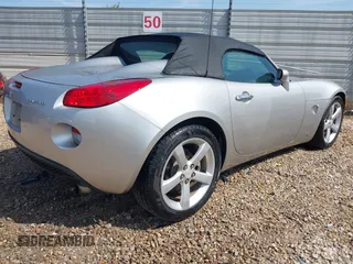 2006 Pontiac Solstice z VIN 1G2MB33B36Y000714, wystawiony jako IAAI lot #42125345 z przebiegiem 101 845 mil mil oraz . Historia ofert i sprzedaży dostępna na DreamBid. Obrazek 4.