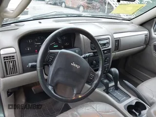 2004 Jeep Grand Cherokee Laredo with VIN 1J4GW48S24C276284, listed as a IAAI auction lot 42596655 with 142,524 mi miles and . Bid and sale history available at DreamBid. Image 14.