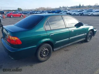 1999 Honda Civic VP with VIN 2HGEJ6617XH508270, listed as a IAAI auction lot 41319879 with 119,549 mi miles. Bid and sale history available at carsss.com. Image 4.