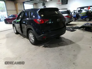2016 Mazda CX-5 Sport with VIN JM3KE2BY5G0782385, listed as a IAAI auction lot 41971163 with 87,251 mi miles. Bid and sale history available at carsss.com. Image 3.