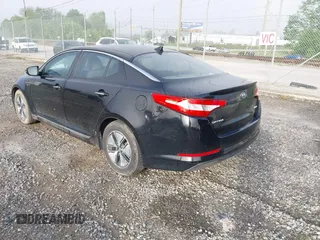 2012 Kia Optima Hybrid with VIN KNAGM4AD7C5010458, listed as a IAAI auction lot 42165589 with 215,018 mi miles. Bid and sale history available at carsss.com. Image 3.