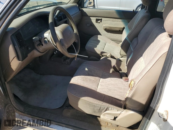 1999 Toyota Tacoma z VIN 4TAVL52N1XZ513889, wystawiony jako Copart lot #50007235 z przebiegiem 225 799 mil mil oraz Szkoda całkowita • Salvage title. Historia ofert i sprzedaży dostępna na DreamBid. Obrazek 7.