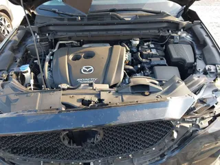 2019 Mazda CX-5 Sport with VIN JM3KFABMXK0693540, listed as a IAAI auction lot 41523569 with 57,895 mi miles and . Bid and sale history available at DreamBid. Image 10.