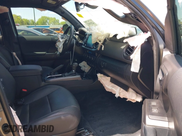 2023 Toyota Tacoma SR with VIN 3TMCZ5AN9PM553246, listed as a IAAI auction lot 42201812 with 20,907 mi miles and . Bid and sale history available at DreamBid. Image 5.