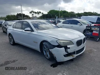 2014 BMW 7 Series 740i with VIN WBAYA6C53ED144195, listed as a IAAI auction lot 41720500 with 123,776 mi miles. Bid and sale history available at carsss.com. Image 1.