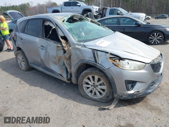 2015 Mazda CX-5 Touring with VIN JM3KE2CY6F0432910, listed as a IAAI auction lot 41784545 with 210,787 mi miles. Bid and sale history available at carsss.com. Image 1.