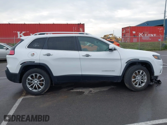 2021 Jeep Cherokee Latitude Lux z VIN 1C4PJMMX4MD221786, wystawiony jako IAAI lot #42432825 z przebiegiem 54 297 mil mil oraz . Historia ofert i sprzedaży dostępna na DreamBid. Obrazek 13.
