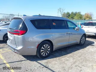 2021 Chrysler Pacifica Hybrid Touring L with VIN 2C4RC1L77MR594630, listed as a IAAI auction lot 41739229 with 79,556 mi miles. Bid and sale history available at carsss.com. Image 4.