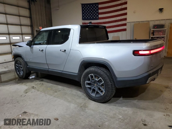 2024 Rivian R1T Adventure z VIN 7FCTGCAA0RN030370, wystawiony jako Copart lot #87251784 z przebiegiem 11 549 mil mil oraz Szkody całkowita. Historia ofert i sprzedaży dostępna na DreamBid. Obrazek 2.
