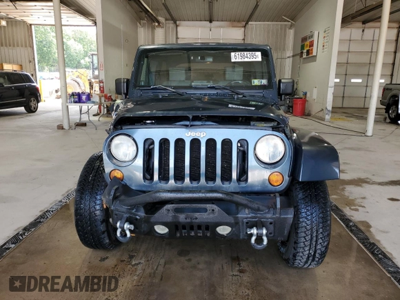 2007 Jeep Wrangler Unlimited Sahara с VIN 1J8GA591X7L217299, выставлен на аукционе Copart как лот 61984395 с пробегом 151 171 миль миль и Списание • Salvage title. История ставок и продаж доступна на DreamBid. Изображение 5.