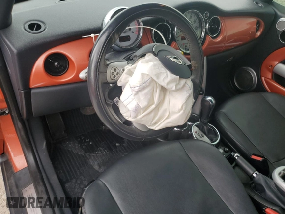 2006 MINI Convertible with VIN WMWRF335X6TG15824, listed as a Copart auction lot 56163205 with 113,109 mi miles and Salvage title. Bid and sale history available at DreamBid. Image 8.