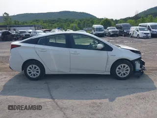 2021 Toyota Prius L Eco with VIN JTDKAMFU7M3147668, listed as a IAAI auction lot 42390394 with 80,831 mi miles and . Bid and sale history available at DreamBid. Image 14.