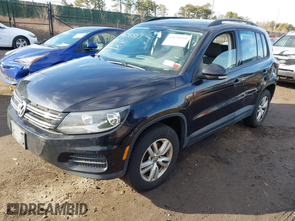 2015 Volkswagen Tiguan SE z VIN WVGAV7AX2FW593453, wystawiony jako IAAI lot #41658359 z przebiegiem 159 619 mil mil oraz . Historia ofert i sprzedaży dostępna na DreamBid. Obrazek 2.