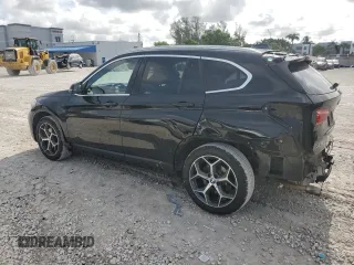 2019 BMW X1 xDrive28i with VIN WBXHT3C59K5L36435, listed as a Copart auction lot 60189985 with 105,110 mi miles and Salvage title. Bid and sale history available at DreamBid. Image 2.