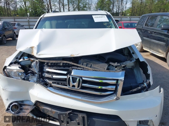 2013 Honda Pilot Touring with VIN 5FNYF3H92DB034731, listed as a IAAI auction lot 42049853 with 127,278 mi miles and . Bid and sale history available at DreamBid. Image 6.