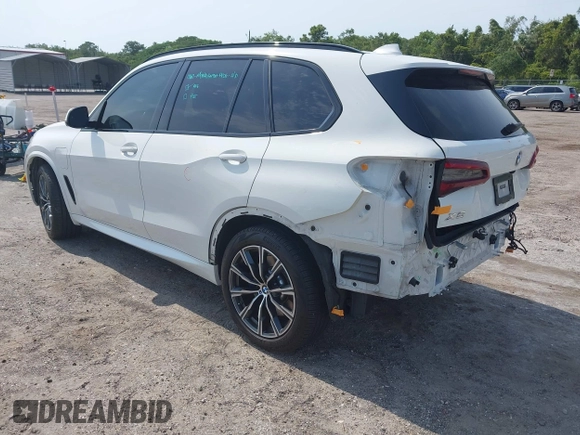 2021 BMW X5 xDrive45e with VIN 5UXTA6C08M9F38909, listed as a IAAI auction lot 42172536 with 71,741 mi miles and . Bid and sale history available at DreamBid. Image 3.