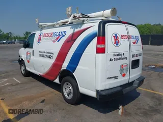2015 Chevrolet Express Cargo Van with VIN 1GCWGFCF8F1255703, listed as a IAAI auction lot 41995763 with 215,212 mi miles. Bid and sale history available at carsss.com. Image 3.