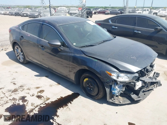 2014 Mazda 6 i Touring with VIN JM1GJ1V55E1105379, listed as a IAAI auction lot 42010585 with 153,870 mi miles and . Bid and sale history available at DreamBid. Image 1.