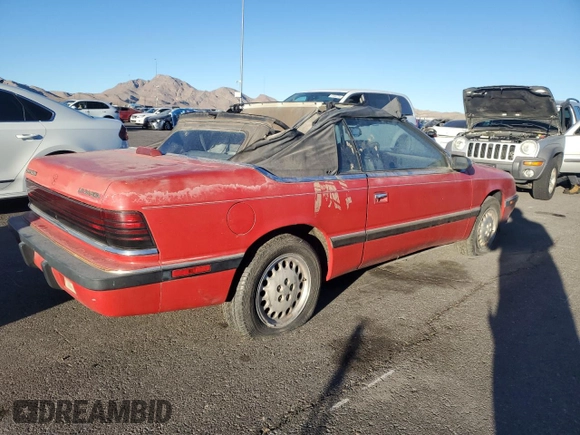 1989 Chrysler LeBaron z VIN 1C3XJ45K0KG251502, wystawiony jako Copart lot #87112404 z przebiegiem 166 445 mil mil oraz Tytuł czysty. Historia ofert i sprzedaży dostępna na DreamBid. Obrazek 3.