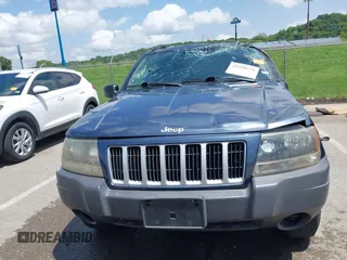2004 Jeep Grand Cherokee Laredo with VIN 1J4GX48S44C205469, listed as a IAAI auction lot 42310571 with 154,929 mi miles and . Bid and sale history available at DreamBid. Image 12.