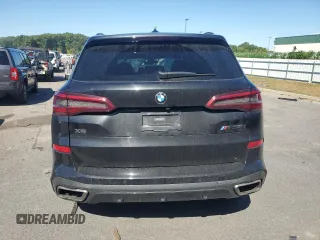 2020 BMW X5 M50i with VIN 5UXJU4C05LL228167, listed as a Copart auction lot 70390194 with Not Provided miles and Salvage Title. Bid and sale history available at DreamBid. Image 6.