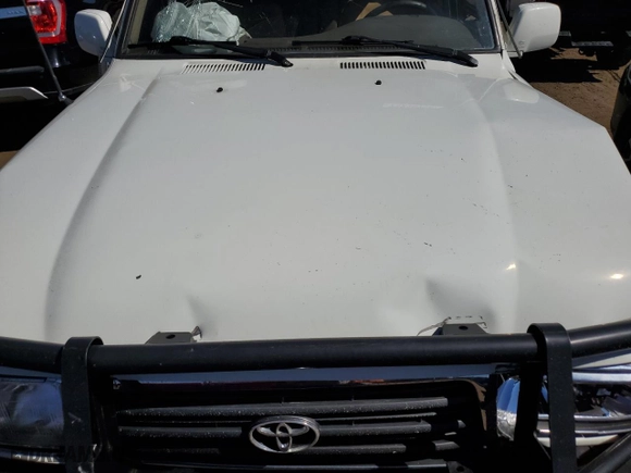 1997 Toyota Land Cruiser with VIN JT3HJ85J2V0180979, listed as a Copart auction lot 73216714 with 239,444 mi miles and Salvage Title. Bid and sale history available at carsss.com. Image 13.