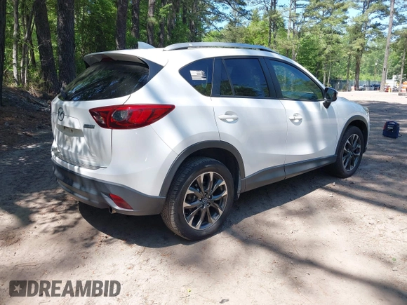 2016 Mazda CX-5 Grand Touring with VIN JM3KE2DY0G0870077, listed as a IAAI auction lot 42158225 with 93,816 mi miles. Bid and sale history available at carsss.com. Image 4.