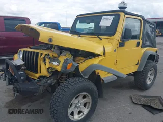 2005 Jeep Wrangler SE z VIN 1J4FA29S95P373313, wystawiony jako IAAI lot #42340611 z przebiegiem 162 801 mil mil oraz . Historia ofert i sprzedaży dostępna na DreamBid. Obrazek 2.