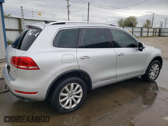 2012 Volkswagen Touareg Sport с VIN WVGFF9BP6CD001833, выставлен на аукционе Copart как лот 54188355 с пробегом 126 272 миль миль и Чистый • Clean title. История ставок и продаж доступна на DreamBid. Изображение 3.
