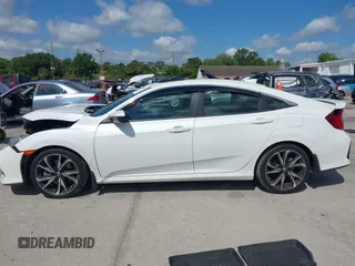 2018 Honda Civic Si with VIN 2HGFC1E53JH700251, listed as a IAAI auction lot 42043732 with 104,763 mi miles and . Bid and sale history available at DreamBid. Image 14.