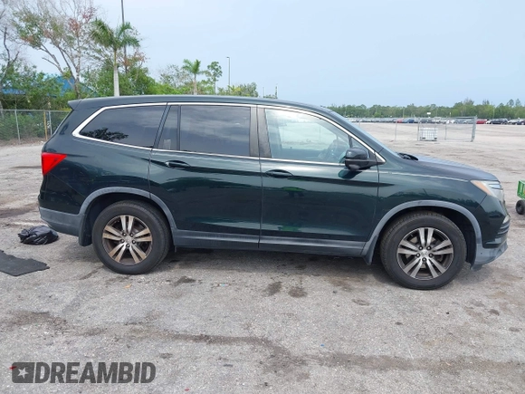 2017 Honda Pilot EX-L with VIN 5FNYF6H50HB033968, listed as a IAAI auction lot 42400720 with 119,597 mi miles and . Bid and sale history available at DreamBid. Image 13.