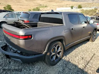 2023 Rivian R1T Adventure with VIN 7FCTGAAA5PN023738, listed as a Copart auction lot 63131724 with 141 mi miles and Salvage Title. Bid and sale history available at carsss.com. Image 3.