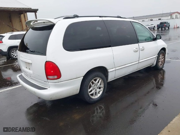 1999 Dodge Caravan SE with VIN 2B4GP44GXXR285795, listed as a IAAI auction lot 41850278 with 2,552,594 mi miles. Bid and sale history available at carsss.com. Image 4.