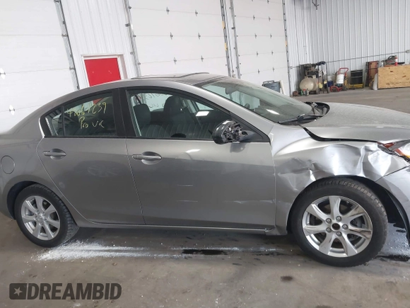 2011 Mazda Mazda3 i Touring with VIN JM1BL1VFXB1900999, listed as a IAAI auction lot 42067239 with 202,829 mi miles. Bid and sale history available at carsss.com. Image 13.